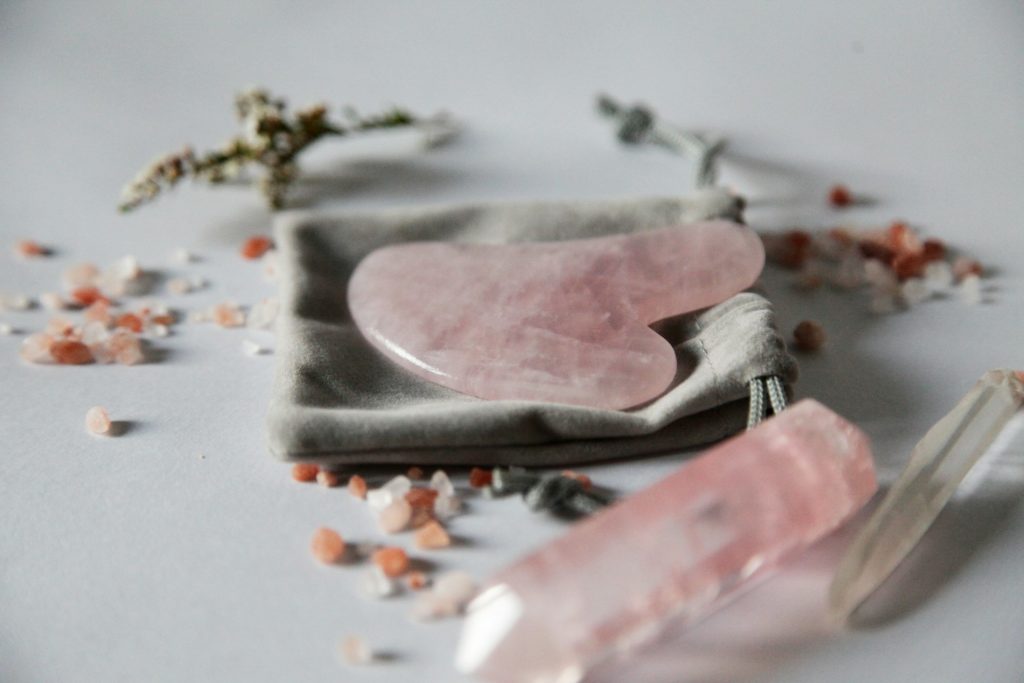 A picture of a rose quartz, which is a great addition to your HSP self-care kit.